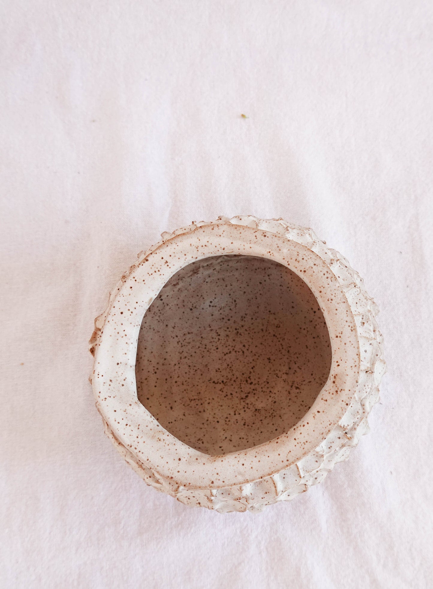 dimpled white speckled vase