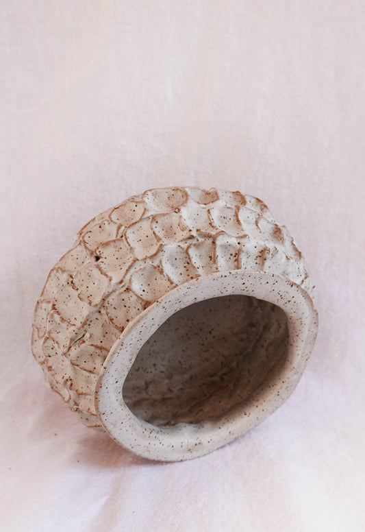 dimpled white speckled vase